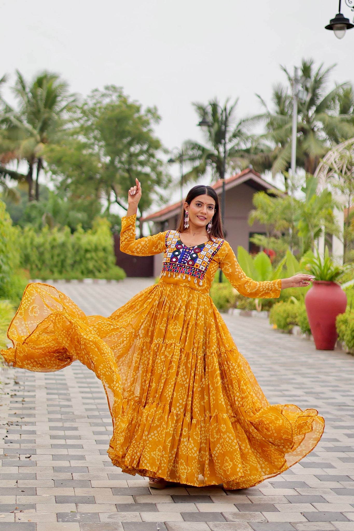 Yellow Georgette Mirror Work Gown For Dandiya Nights